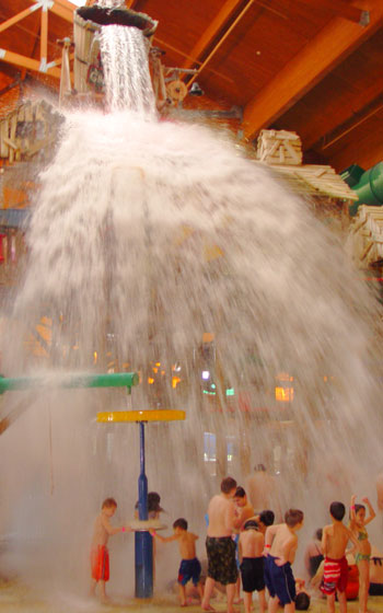 The 1,000 gallon bucket drenches the kids below